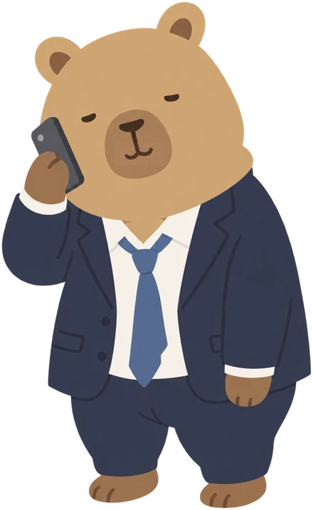 スーツ姿で電話をかけているクマ